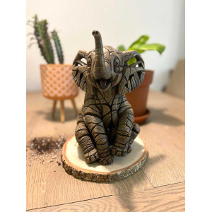 Suggestion de présentation: utilisez un rondin de bois comme socle pour valoriser votre sculpture!